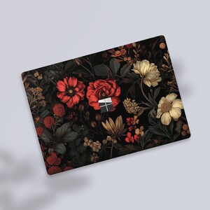 a close up of a mouse pad with flowers on it