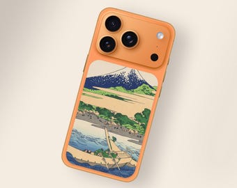 May include: Orange phone case featuring a Japanese landscape design with a mountain, water, and boats. The case has a triple-lens camera and a flash. The design is a classic Japanese woodblock print style.
