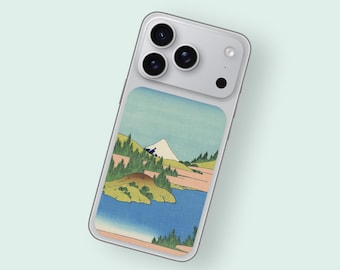 May include: A silver smartphone with a landscape design case. The case features a colorful illustration of a mountain, lake, and trees. The artwork is in a traditional Japanese style, with a blue, green, and pink color palette.