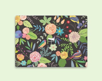 May include: Rectangular decorative mat with a floral and bird pattern. The design features colorful flowers in shades of pink, yellow, and peach, along with green leaves and small birds against a dark background.