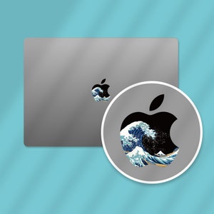 an image of an apple logo on a mouse pad