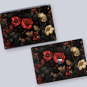 two laptops with floral designs on them