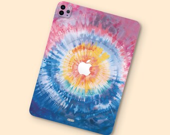 May include: A tablet case with a vibrant tie-dye design in shades of pink, blue, yellow, and white. The Apple logo is visible in the center. The case has a smooth finish and a rectangular shape.