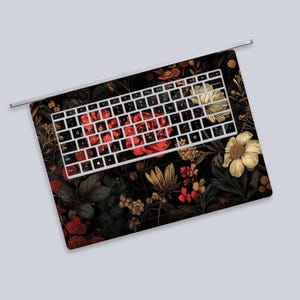a computer keyboard with a floral design on it