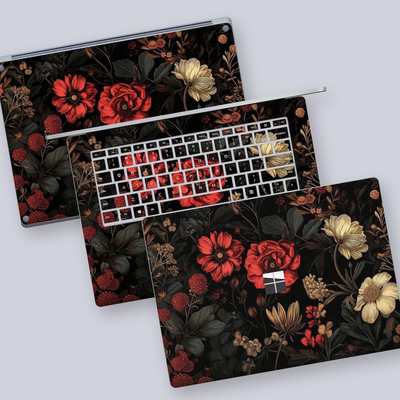 a computer keyboard with a floral design on it