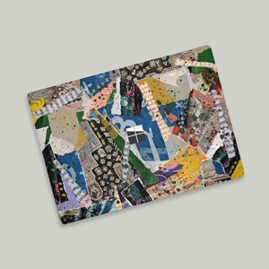 May include: A colorful collage of torn paper scraps and printed text, with a blue and white square in the center. The background is a light gray.