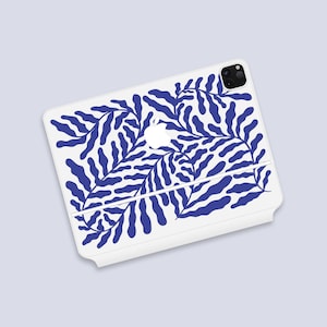 May include: White phone case with a blue and white abstract leaf pattern. The case has a cutout for the camera lens.
