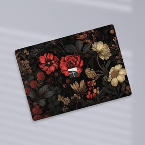a close up of a mouse pad with flowers on it