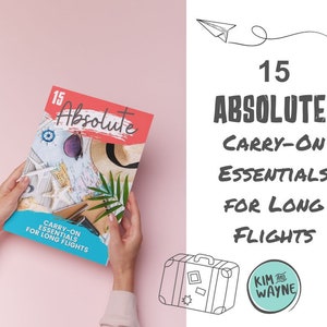 May include: A pink background with a magazine cover that says "15 Absolute Carry-On Essentials for Long Flights" with a picture of a beach scene. The magazine is being held by a person's hands. There is a suitcase and a logo that says "Kim and Wayne" on the right side of the image.