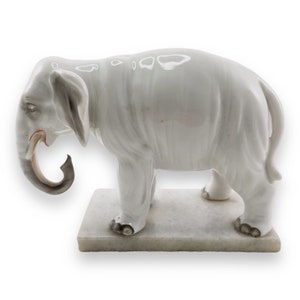 Porcelain elephant on marble base