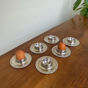 Vintage Mid Century Modern Baroque design 6 piece egg cups in 18/8 stainless steel by WMF Cromargen, MCM breakfast, Modernist table plates