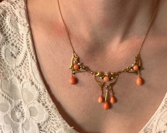 Antique coral jewelry ensuite dates late 19th century.