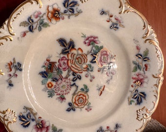 19th-century English "flow blue" porcelain embossed with gold