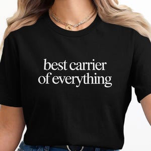 Black t-shirt with white text "best carrier of everything".