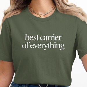 Green t-shirt with white text "best carrier of everything".