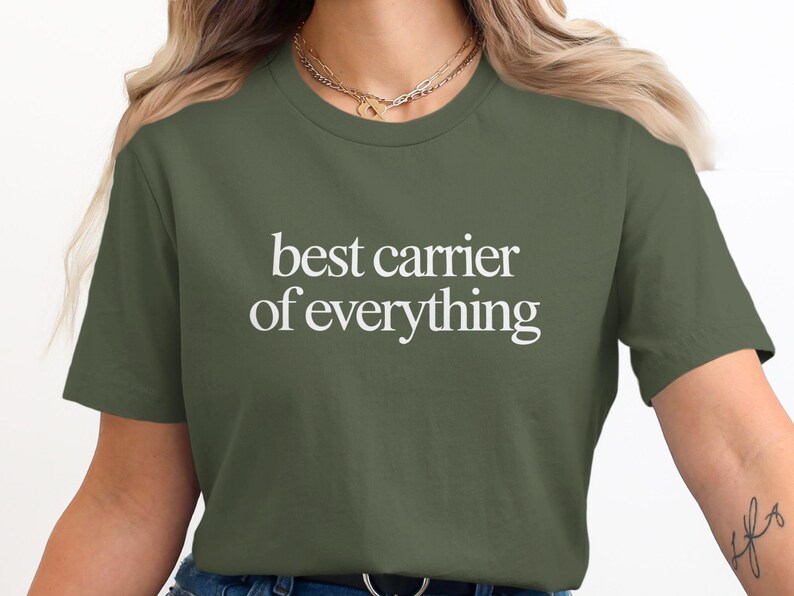 Green t-shirt with white text "best carrier of everything".
