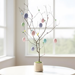 May include: A decorative Easter tree with pastel-colored egg ornaments. The tree is in a woven pot and sits on a white table. The eggs are pink, blue, green, and purple. The tree is in front of a window.