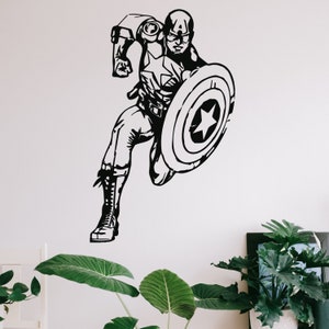 以下が含まれることがあります： 盾を持ったキャプテン・アメリカが走っている白黒のシルエット。画像はウォールステッカーです。