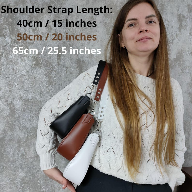 May include: A woman is wearing a white sweater and is holding three different colored bags. The bags are black, brown, and white. The shoulder strap length options are listed as 40cm/15 inches, 50cm/20 inches, and 65cm/25.5 inches.