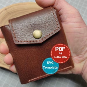 May include: A brown leather wallet with a flap secured by a brass snap. The wallet is hand-stitched with brown thread. The image includes two circular stickers with the text "PDF A4 Letter USA" and "SVG Template".