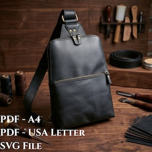 Può includere: Una borsa a tracolla in pelle nera con una tasca frontale verticale con cerniera, uno scomparto principale con doppia cerniera e una tracolla regolabile. La borsa presenta cuciture a vista e finiture metalliche. Testo: PDF - A4, PDF - USA LETTER, SVG File.