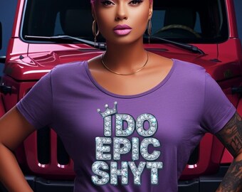 May include: A woman wearing a purple t-shirt with the text "I DO EPIC SHYT" in a jeweled font. She has short, purple hair and is wearing blue jeans. A red vehicle is in the background.