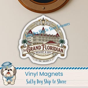 May include: A die-cut vinyl magnet featuring a detailed illustration of The Grand Floridian Resort & Spa. The design includes the resort building, palm trees, a lantern, and a banner with the text The Grand Floridian Resort & Spa Est. 1988 Orlando, FL.