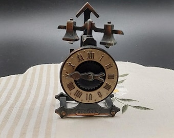 Miniature cuckoo clock, vintage clock, antique cast metal clock, clock sharpener, collectible stationery. Dollhouse clock