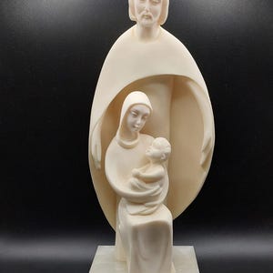 Statue of the Holy Family. Jesus, Mary, and Joseph. Religious statue. Alabaster figure. Religious decoration. Religious decoration