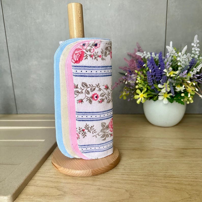 Cotton flannel unpaper towel roll in French country style, featuring reusable paperless kitchen towels with floral and pastel designs. Flannel naturally sticks to itself, so no buttons are needed to roll it up. Best stored wrapped around an empty paper towel roll. A perfect farmhouse kitchen accessory and zero waste gift.