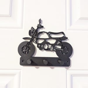 May include: A set of three ceramic mugs with a speckled, matte finish. The mugs are in shades of cream, light gray, and dark gray. Each mug has a simple, minimalist design and a rounded handle. Perfect for coffee or tea.