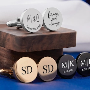 May include: Set of six silver, gold, and black cufflinks with engraved initials and dates. The cufflinks are displayed in a wooden box.