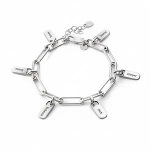 May include: A silver-colored link bracelet with six rectangular name charms. The names "James", "Sophie", "Harper", "Jack", "Rebecca", and "Emma" are engraved on the charms. The bracelet has an adjustable chain and a clasp closure.