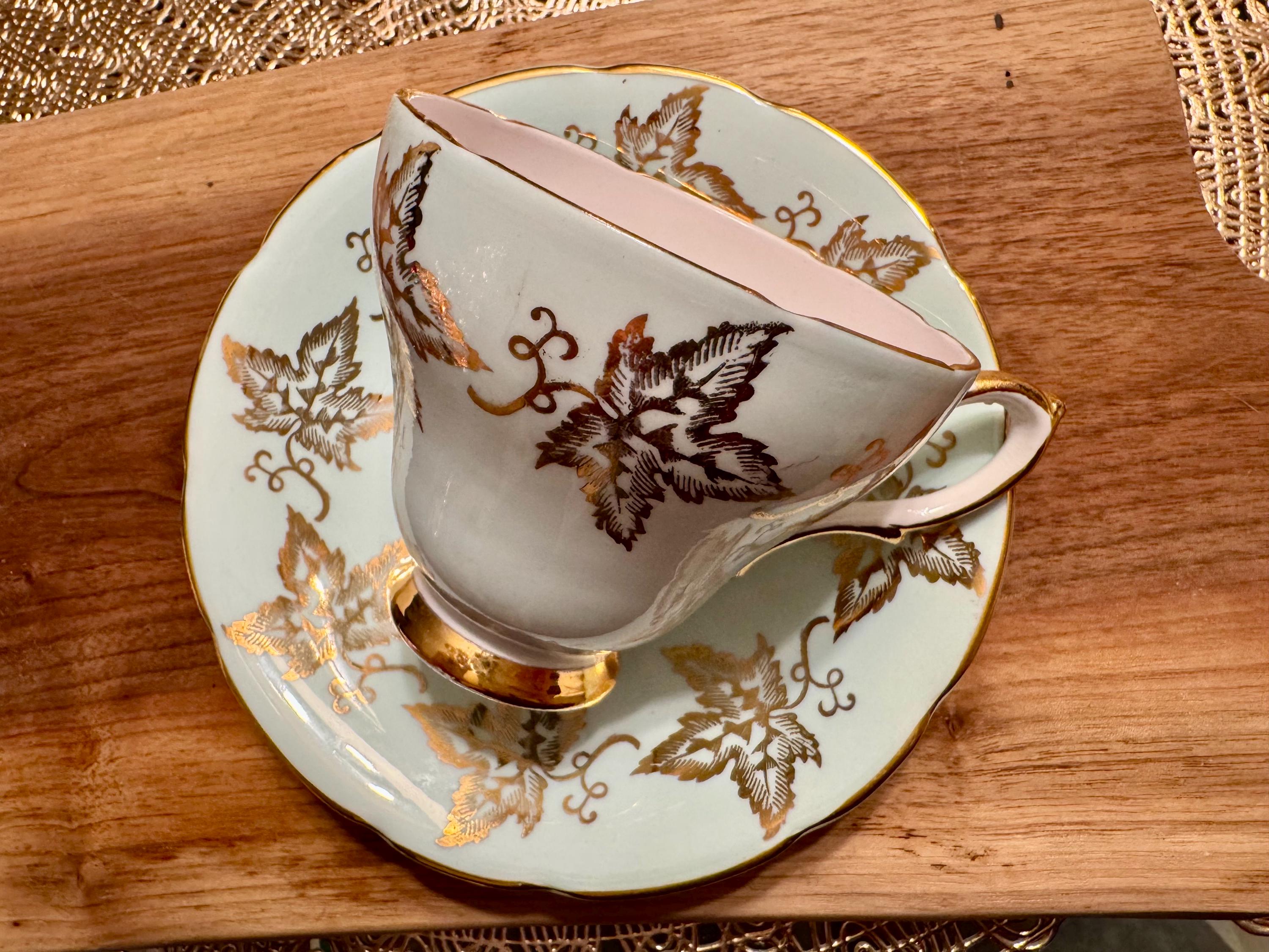 Vintage Sutherland Bone China Cup and Saucer: Pale Blue, Gold Leaves, Pink Roses
