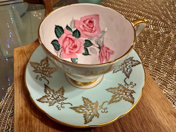 Vintage Sutherland Bone China Cup and Saucer: Pale Blue, Gold Leaves, Pink Roses