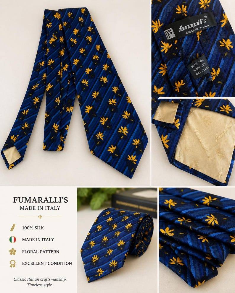 May include: A navy blue silk tie with a floral pattern. The tie features yellow flower designs and blue stripes. The label reads "Fumaralli's Made in Italy" and "100% Silk". The tie is in excellent condition.