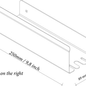 May include: A U-shaped metal wall mount organiser with a hook on the right side. Dimensions are 250mm/9.8 inches long, 89mm/3.5 inches wide, 72mm/2.83 inches high on the left, and 45mm/1.77 inches high on the right. Text reads: Hook on the right.