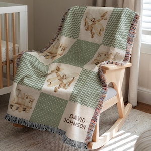 May include: A woven baby blanket with a patchwork design featuring airplanes and trains in soft beige and green hues. The blanket is draped over a wooden rocking chair. The name "DAVID JOHNSON" is printed on the blanket.