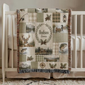 Personalized woven hunting and fishing baby blanket featuring deer, mallard ducks, bass fish, rustic cabin, lake, canoe, pinecones, woodland patchwork, custom baby name, outdoor nursery decor, baby shower keepsake.