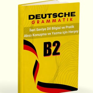 May include: A yellow book with black and red stripes on the cover. The title is "DEUTSCHE GRAMMATIK" and the subtitle is "Ileri Seviye Dil Bilgisi ve Pratik Akıcı Konuşma ve Yazma için Herşey". The book is labeled "B2".