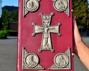 The Holy Gospel with a silver covered brass linings