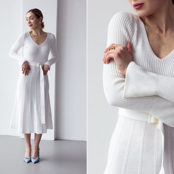 Milky white sweaterdress with V-neck and pleated skirt. Knitted warm winter dress in white color. Girl's sweaterdress A-Line