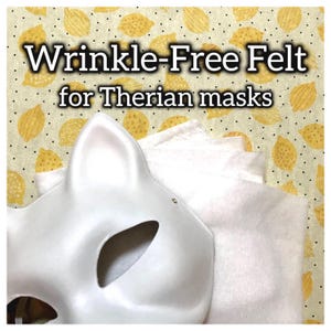 May include: A white cat-shaped mask with eye cutouts and a stack of white felt. The text "Wrinkle-Free Felt for Therian masks" is displayed in a black font. The background is a yellow fabric with lemon designs.