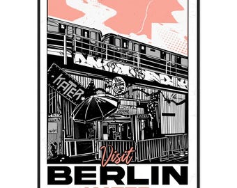 May include: Black and white poster with a Berlin theme. The poster features a train, a building with the word "KATER" on a sign, and the words "Visit BERLIN KATER" in bold text. A pink cloud-like shape is in the background.