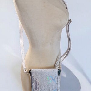 Slim Sling with iridescent snake vinyl, smart phone accessible, minimalist