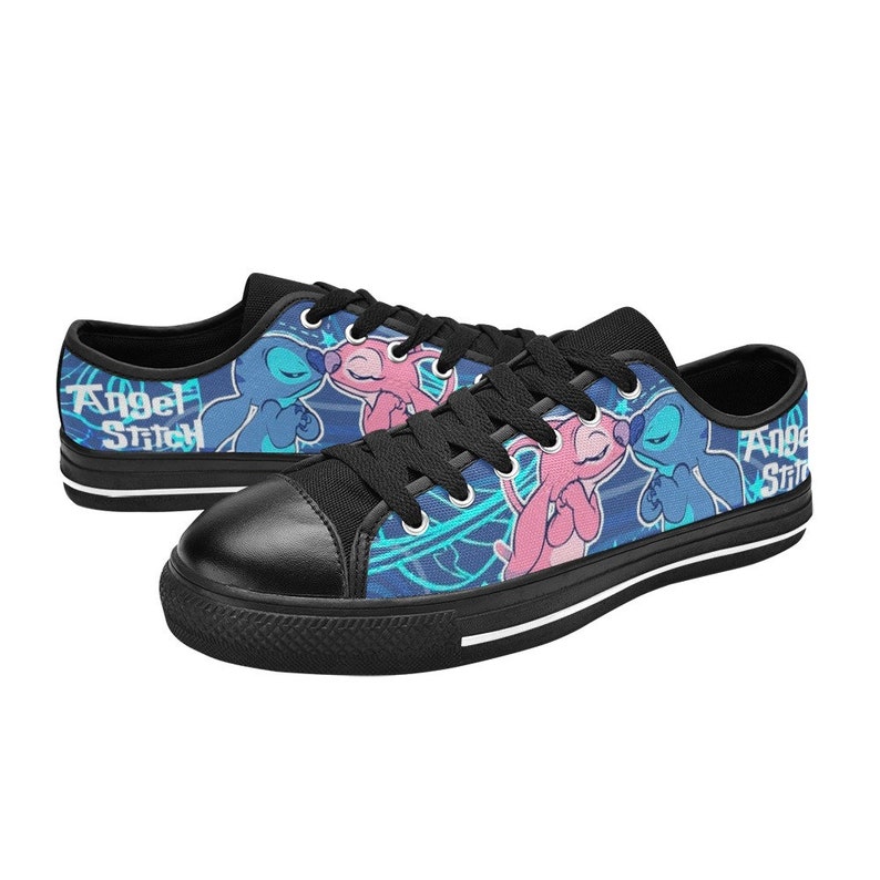 May include: Black canvas low-top sneakers with a blue and pink graphic print of Stitch and Angel from Lilo & Stitch. The text "Angel Stitch" is printed on the side of the shoes.