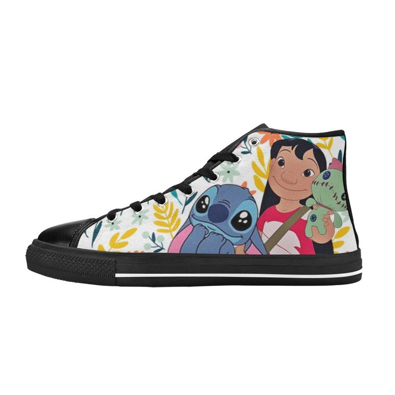 May include: High-top canvas sneaker featuring a colorful floral pattern and a graphic of Lilo, Stitch, and a doll. The shoe has a black toe cap, black laces, and a black sole with a white stripe.