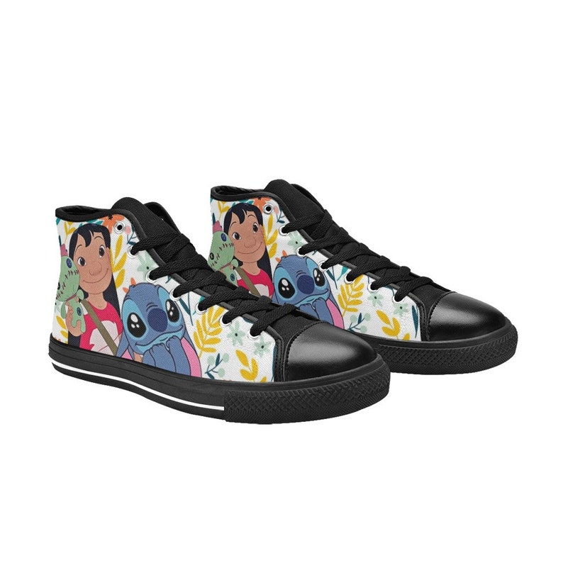 May include: High-top canvas sneakers featuring a colorful floral pattern and cartoon characters Lilo and Stitch. The shoes have black laces, a black toe cap, and a black sole with a white stripe.