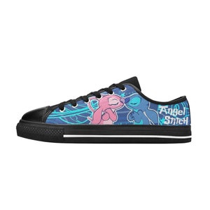 May include: Black canvas low-top sneakers with a blue, pink, and white design featuring Stitch and Angel from Lilo & Stitch. The text "Angel Stitch" is printed on the side of the shoe.
