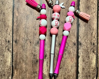 Breast cancer awareness pen with added charm